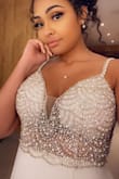 Wore this as my wedding dress and everyone absolutely loved it! I had a seamstress make the straps a little shorter and add cups to the dress for more breast support. If you have big breasts I'd definitely size up and just get the rest of the dress altered. It's such a beautiful dress! - Angel T.