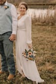 Was looking for a wedding dress to get pictures in because my original dress was not altered in time due to the pandemic. Found this dress and it turned out great! It is loose, but still looks great in my opinion. I was comfortable the whole time wearing it. We had to cancel our wedding celebration so we ended up just having pictures with our bridal party. My only complaint was that it is very sheer. You can see any bra that I tried to wear. I also didn't like the idea of seeing straps. I ended up buying the nude nipple cover ups. They worked great, but didn't give me the 'lift'. Overall, worked great for me! - Marie R.