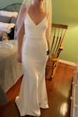 While I didn't pick it as my wedding dress, it was my second choice. It's super sexy and classy. I'm tall with a smaller waist and larger bottom, and felt it really complimented my body type. Very comfy and stretchy, and a little big to be honest. My only issue was it wasn't glam/wedding enough. My mom tried it on too (second pic- she's a size or two larger than me) and she looked fantastic. So consider sizing down! - Nicole B.