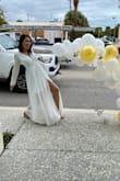 I wore this dress for my bridal shower. It's very long but that only makes sense for the taller ladies. I got it altered and had them shorten the under layer to make it not as dressy. The top fits a little weird but nothing too noticeable. Happy with this purchase - Christy K.
