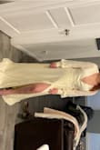 I love this dress, my only complaint is that it's a tad booby-liscous. Additionally, it's definitely made for someone on the taller end of the spectrum. Definitely have to get mine tailored. Also, in some lighting it comes off as more of a yellow than ivory. - Macy B.