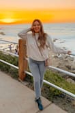 This sweater is so comfortable and the material is really great quality. I was a little nervous that the material would be itchy (especially in the neck area), but it was not at all. Received so many compliments! - Patricia S.