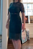 The green is pretty! Dress is comfy, high quality and looks just like the pic. I was a bit worried the exposed waist would be kind of trashy but it's very modest. It's right at the top of my knee. - Keri M.