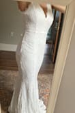 I love this dress! I ordered a small, was able to fit it, but I have large breasts that I felt were a bit more exposed that I prefer, I returned and ordered a medium. Medium fits perfect in my chest, but I will have to take it in a bit. Not a big deal as I am wanting to use this dress for my beach wedding, so I am going to have the seamstress add buttons to the back zipper. This dress is perfect as it is light and has a bit of stretch, while still accentuating your curves. My seamstress also could add pearls to the bodice for a bit more of a wedding feel. I'm a pretty simple lady, and I think this dress looks great without anything extra if you didn't want. This truly is a wonderful option for a beach destination wedding. I can't wait to wear it on our big day! - Gina S.