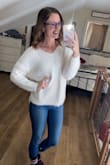 I love the warmth and design of this sweater, it fits well everywhere but in the sleeves. When I first put it on, the sleeves barely reach my wrists, and seem to shrink up as the day went on. I'm not sure if sizing you would fix this problem either. Otherwise, I loved this sweater! - Rachel S.
