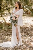 I ordered this dress among tons thinking it would be the LAST thing I would wear for our private elopement. However, when I put on the dress I was absolutely stunned. I felt like a bride, the material was well made, and the fit was flattering in all of the right places. I was super worried about sizing, but felt great in this dress all day. I would highly recommend this dress for ALL types of weddings. It is beautiful and the value for it is a steal. - Kelly Z.