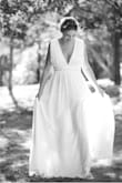 I'm usually a size small but ordered up a size due to being 6 months pregnant at the time. Very comfortable dress and so stunning and affordable for my small ceremony! I wore sandals and never felt like I was going to trip over the dress. I also did not need a support bra, only pasties and felt very supported and covered. My husband loved this dress. It showed just enough :) I'm just so happy with how it looked in our wedding photos! - Faren R.