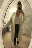 OK, I know better - buying things at "Final Sale" is a risk, but this looked so cozy, and it was exactly the color of a winter ivory staple piece I'd been looking for to add to my collection. Sadly, this cardigan is better suited as a house robe than anything you would consider throwing on with pair of heels - I ordered a small and I'm still swimming - but the most disappointing thing is the color. Next to my other ivory pieces, it looks almost yellow. It is relatively comfortable - so it's not all bad - it's just not all good. - Lindsay S.