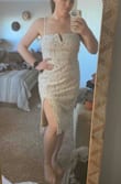 This dress is gorgeous. I bought it to wear at my rehearsal dinner this summer. Fits a little loose but still looks great and is very comfortable. - Lizzy B.