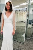 Absolutely love it. Very easily paired with sash/belt and veil. The dress runs long and I need to wear very high heels or hem it to avoid tripping forward on it. It's beautiful white lace, the material is comfortable and soft, and it's easy to move around in. I just wish there was a button on the dress to hook up the train or elevate it a bit for the reception when dancing and walking around to avoid getting the bottom of the dress dirty or tripped over. Perfect fit- very true to size. I'm about 5'5 and half between 5'6 and pear shaped. It's flattering for my body type. Thank you Lulus for making this so lovely! Very happy with it! - Jackie M.