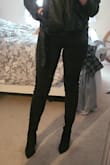 Im 6ft, average build. Without pants underneath (aka skirt) the top of the booties don't stay up. I have slimmer legs? I guess? Lol. But with jeans they stay on perfect. True to size to the T. They're so sexy looking and easy/comfy to walk in. They're approximately 4 inches above my knee standing up and my legs are roughly 4 feet long soooooo... do the math lol. Definitely recommend every girl gets a pair of these. And on sale? Can't beat it. Haven't wore them for a GNO yet but will shortly and I'll update if they hold up or not. - Samantha D.