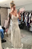 I absolutely love it and can't wait to walk down the aisle in it. I ordered a Medium and am very glad I did because I can alter the waist a little bit in, but really don't HAVE to. I wouldn't have fit into the small. - Stephanie D.