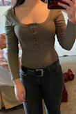 Originally loved when I first tried on. However with a full day wear the sleeves do not stay up. The shirt is constantly needed to be readjusted. Might try shrinking the shirt and see if that helps. - Kendra T.