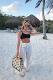 The waist is extremely wide however, it fits perfectly when tightened. I actually love the crinkled look at the waist when tied. Overall, super cute & perfect to bring on vacay. - Emine K.