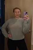 This is such a cute and cozy sweater! I purchased in a medium and got the slouchy look that I was going for - if you want it to come in tighter towards the bottom I would suggest going a size smaller. I love that it is a lightweight sweater that doesn't cause me to get too warm, it's easy to layer with if need be. The light grey is such a great color and I've had fun dressing this top up for a night out or for a cozy day at home. Pretty much my go to on the weekends. <3 - Laura B.