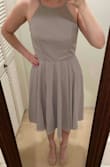 Love this dress! The cut/length makes it very versatile - its both work appropriate and cute for a party as well. It sits right around/below my knee since I'm on the shorter side. The material is soft and flowy - it's a little bit wrinkled from shipping but nothing a quick steam can't fix. I'm glad I got the small as my chest is a little on the smaller side - Charna C.