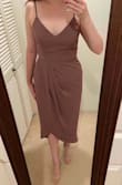 I am always hesitant to get longer dresses since I don't like to get things altered. This midi dress fits great! The front slit sits at my knee (shows to about mid-thigh when walking around) and the back is between my calf and ankle. The straps are adjustable which I like. The material is light and cool. It's a little wrinkled from shipping but seems it would be easy to get out with a quick steam - Charna C.