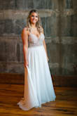 Loved this dress so much! I got so many compliments and no one could believe I didn't pay thousands at a bridal shop for it! We did end up having to have a micro wedding due to covid, but this was going to be my dress either way. I bought the size 10 and needed the straps and cups adjusted. - Brianna R.