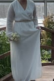 I have a smaller waist so I think the medium would have fit but I have heavy upper arms so I went with the large. It was perfect. I added the belt and received compliments on it from many people. Even though it was below zero out, it worked for a winter wedding. Thank you for making me feel beautiful on my day! - Julie S.