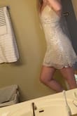 This dress is so beautiful in person! I love the different colors and with the flash on, it's very bright and silver/white. I was right in between XS and S. Started with S but I'm short and it looks too baggy on me. XS fits perfect but a little snug to zip up. - Tori A.