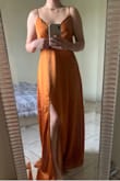 The dress color and style are beautiful, but the overlaying top flings wide open unless I close it together with my hand. I think it has to do with the size and fit because it feels pretty big on my bust. Nothing that's not fixable with a little altering though. I love this dress. - Ashleigh P.