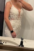 I had originally had a $1400 wedding dress that I had worn for our ceremony. Due to COVID we postponed the reception. I thought maybe I'd look at getting a different dress but I didn't want to spend a lot. For the price, it looks absolutely gorgeous. It is not as thick as my $1400 wedding dress, but I'm glad it isn't since our reception is now in August. They unfortunately don't carry a size 0 which I usually am, so I ordered a 2 it was slightly big, which is to be expected so I would say it is definitely true to size. There is a ton of glitter on this dress and the top and back is absolutely gorgeous. - Alexis S.