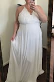 I read all the reviews and looked at all the review photos before purchasing this dress. I was looking for a flowy, sexy beach wedding dress. The dress is pretty, much heavier than I expected (very good quality!), and not even close to the low cut images I saw, which is one of the things I wanted. I felt matronly in the dress and will return it.
Again, very good quality and a bargain price, just not my dress. - Tina T.