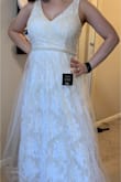 I love the dress! I wanted something simple for my more casual wedding and this fit the bill. I'm a little short at 5ft 4, so I'll have to get the straps taken up a little bit and lose some length at the bottom. But other than that it fits great! And you can wear a regular bra with it which is a requirement for any dress I buy. - Ann K.