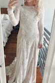 I have been looking for this exact dress for months now! I found similar dresses but they were upwards of $3,000! The dress is very flattering and comfortable. I would definitely order a size down if you are between sizes because it runs large. Also, I am a 32D bust and am wearing boob tape to minimize in the photo, but you can easily wear a bra if you prefer (as long it's low enough for the back). - Emily P.