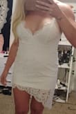 This dress fits true to size. I ordered a size 14. I am tall for a girl and was a little concerned about the length but it fits perfect! Our elopement is in Maui and I wanted a dress to change into after the ceremony that still resembles the bride look/feel and this is PERFECT! (The picture doesn't do it justice.) - Alisha P.