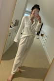 I got this set for my upcoming bachelorette weekend. As the other reviews said the top is very long. But once I got the hang of tucking it in it works pretty well. Likely would not be willing to pay full price for it but for the sale price I would recommend. Super soft and the way the fabric hangs is very flattering. - Sarah M.