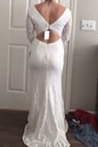 The dress does look similar to pictures, but it's very full coverage and and was too tight around my thighs. The cut of the back is cute, and I love the V cut in the front. - Madi S.