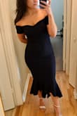 The quality of the material is thick and feels high-quality. I wasn't sure about it the first time I tried it on... I'm 5'3" and it was longer on me than the model in the picture, so I thought it didn't look quite right. I tried on a few more dresses and came back to this one - I might not be as tall as the model, but it still looks great :) - Julie M.