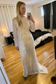 This dress is beautiful! Such nice quality and doesn't feel super heavy while on. I ordered a small and it was perfect for me. The train on the back makes it so elegant! I love it and am going to wear to my rehearsal dinner :) - Stephanie C.
