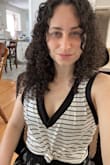 This tank top is exactly what I hoped it would be! You can easily dress it up or down and the material is very soft and stretchy. I knotted it in the front for a more fitted look but it's cute either way. Plus the neckline gives a lot of breathability for the warmer months without being so low that your bra pokes out! - Lisa S.
