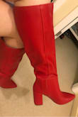 I couldn't wait to receive this shipment and it arrived quickly in Canada. These boots are such a sexy red. Would be perfect for jeans and a white tee or a cute mini skirt. I LOVE these! There is a small seam on the inner ankles that is slightly open with a cream colour showing, which may bother some people, but I'm ok with it. I'm usually a 7.5/8, these felt a little tight when I put them on but I've been wearing slipper, runners and winter boots for a while so I think they fit just right. I'll have to get used to wearing heels again. Another great Lulus purchase! My favorite online shop. - Stacey S.