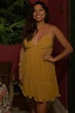 Ordered this dress as an outfit and swimsuit cover up for a trip to Jamaica. It was perfect for the tropical weather and can be dressed up or down. The straps were a little confusing, but I ended up tying as a halter and making smaller knots to keep it in place. The back portion of the dress was a little wonky, but again it's made to be a sun dress that is easy to throw on over a swimsuit. The color is gorgeous! - Angelina R.