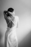 This dress is much heavier and fitted than you'd expect from the photos, but it's perfect! I took a few photos right when it arrived and it photographs like a dream. Such a good buy, I definitely recommend for any brides with a minimalist dream and a budget. - Raelee W.