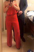I am obsessed! Cutest jumpsuit. I wore to a wedding on NYE. The color really popped and the top fit great. I didn't have to wear anything under it! Material was stretchy and comfortable. Only had to hem the bottom because I am shorter! I want it in other colors! Great closet staple! - Casey B.