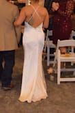 This dress was perfect!! I ordered a Small and it fit a tad loose, but this meant I was able to move freely and comfortably throughout my entire wedding. I had it altered to decrease the length and to bring it in tighter between my chest and armpits, which were very slight alterations. This dress is simple, elegant and I'm very thankful I found it! - Miranda W.