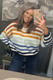 This is one of my new favorites! It's def cropped, but with high waisted jeans it looks good! The colors are stunning. I bought a large for a looser look, and it fits just right. - Krysta W.