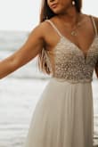 Very beautiful dress with great beads detail it was the perfect dress for my wedding. Only this I didn't like was how long it was but very easily hemmed. - Lilia Y.