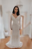 When I saw this dress online for the first time, I immediately fell in love. My family kept telling me not to order it, I shouldn't order my wedding dress online, and so on. However, I am so glad that I didn't listen to them. This dress fits near perfect on me! I am planning on having a few alterations done to make it completely seamless, but even if you decided not to, the dress is very very true to size. I am also planning on adding a pearl belt to the dress to cover up the seam, but the seam is not noticeable and it is a completely optional add-in. Also, shipping and handling was so quick, which is hard to do during the pandemic, so I was very pleased with customer service as well! I'm still so over the moon about how beautiful my wedding dress is and so are my relatives. If you are looking for a boho look for your winter wedding that won't break the bank, then look no further! - Kristen S.