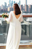 Such a flattering and beautiful dress. True to size, check your measurements. It was a bit long but shouldn't your wedding dress be long and luxurious anyway?! It's simple and elegant enough for micro wedding yet formal enough for a traditional large ceremony. I got tons and tons of compliments. I recommend getting a strapless/backless bra because it has a low back and a sheer cleavage area. I did not want to take this dress off! - Hayley R.