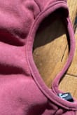 The style is super cute, but the ribbing on the collar is sewn on poorly and makes it look cheap. Also, the tag is really scratchy - Sarah M.