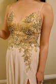 So this dress color was way different than what I expected.  I was thinking the dress will be a cream colored but it was more of a champagne color with a hint of beige. Personally, I was not a fan of the jeweled top; kinda seemed too costumey for me. The fit was really great though since the back had a lace up. - HaRi K.