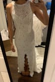I usually wear XS and a tighter fit but this was really tight. Like almost can't breathe tight. I would size up if you are contemplating this dress and are around my size. Like the other reviews say the train is very long compared to any other dresses on this site, but it wasn't a bad thing. The slit does not rise too high, but it was right in the middle which looked weird to me. - Cristina M.