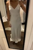 Nice material and a beautiful dress. It's silky smooth on the skin and not very thick so petals and super seamless underwear are a must. This would be a nice dress for a beach wedding! - Cristina M.