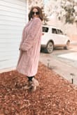 This jacket does run very large (my fault for not reading that before purchase) BUT it feels absolutely amazing, so warm, and definitely makes me feel my boujiest! - Taya A.