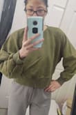 The material is a very nice, thick, sweatshirt material and it is perfect for wearing over a cute bralette/sports bra or even going braless! it's thick so no worries about nips showing through the front lol! I definitely want to get this in more colors! - Jessy C.